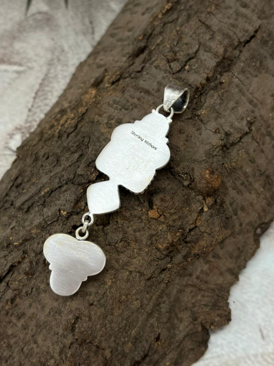 Handmade Sterling Silver White Buffalo Pendant with Signed Nizhoni