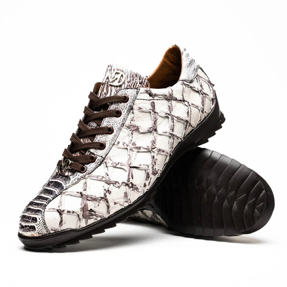 Close-up of Batistini sneaker showing overlapping Pirarucú skin scales and ostrich quill leather texture.