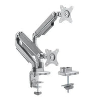 Dual monitor arm with mechanical spring and sleek black design mounted on a desk holding two monitors.