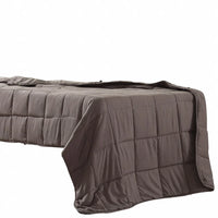 Close-up of quilted weighted blanket fabric highlighting soft polyester mink material.
