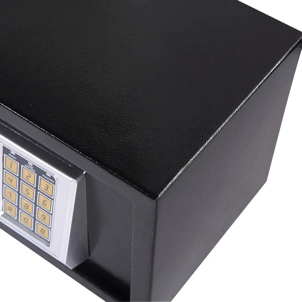 Close-up of electronic safe digital keypad and override keys placed beside it.