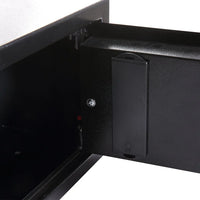 Safe mounted inside a wooden cabinet shelf for discreet secure storage.