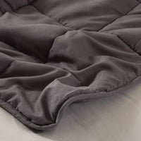 Side view of the weighted blanket showing thickness and filling inside.