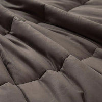 Profile view of DreamZ weighted blanket emphasizing its depth and heavy fill.