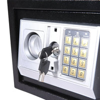 Electronic safe shown with its door ajar, revealing locking bolts and hinges.