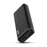 Naztech 4000mAh USB-C and USB power bank charging a smartphone and wireless earbuds