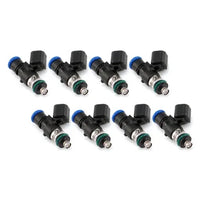 Side angle of motorsport fuel injector highlighting nozzle and electrical connector.