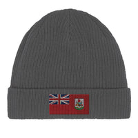 Green organic cotton beanie showing its stretchable ribbed texture