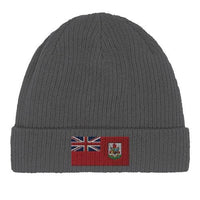 Top-down view of the green organic cotton beanie with Bermuda flag patch