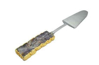 Amethyst gemstone cake server with gold trim displayed on white surface