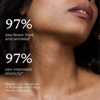 Woman gently applying neck creme to her throat and chest area.