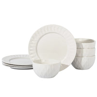 White ceramic 8-piece dinnerware set with simple geometric patterns displayed on a white surface.