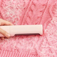 Demonstration of the hair remover brush and lint roller system with dustbin feature.