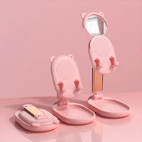 Side view of blue mobile phone holder featuring mirror and foldable design.