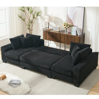 Large black U-shaped corduroy sleeper sofa with pull-out bed, square arms, and cushion back, seats four.