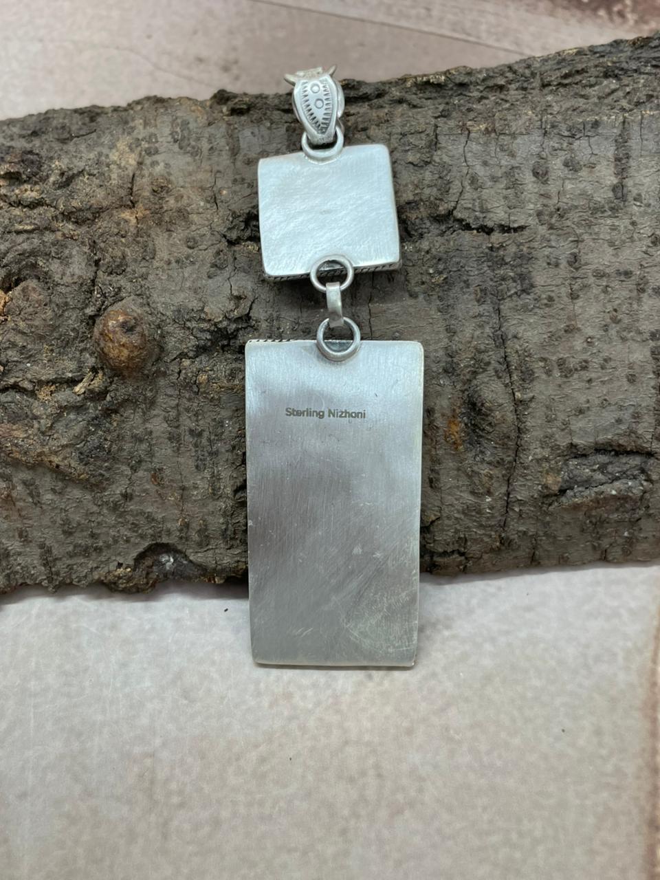 Handmade Sterling Silver White Buffalo Pendant with Signed Nizhoni