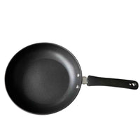 Side angle of Cheftop frying pan highlighting thick carbon steel body and ergonomic handle