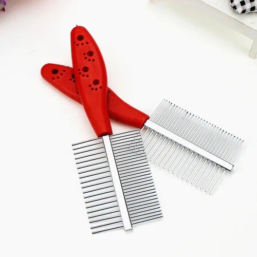 Red double-row pet comb leaning on a white background with focus on ergonomic handle and teeth design