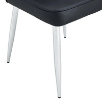 Set of black minimalist dining chairs arranged in dining room setting