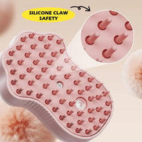Electric grooming comb held by hand, showing compact and ergonomic design.