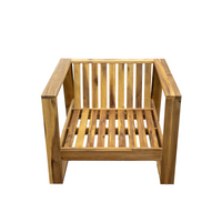 Lounge set on garden patio with acacia wood chair and ottoman in natural finish