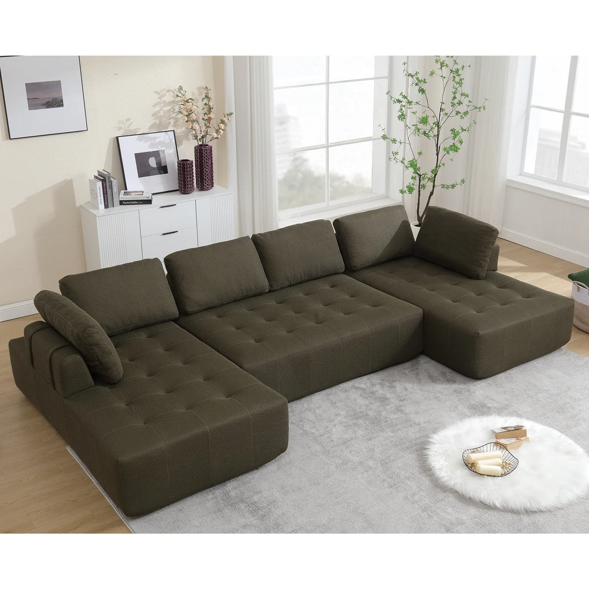 Green modular U-shaped living room sofa with plush cushions and upholstered in polyester fabric.