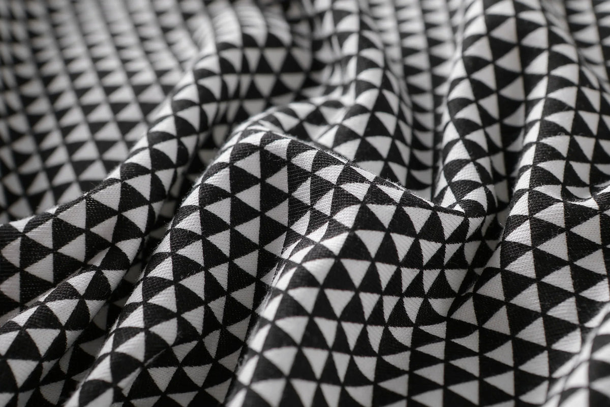 Baby sleeping peacefully inside the breathable, lightweight Greenwich baby sleep bag.