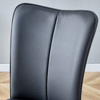 Dining chair seat showing black PU leather cushion and sponge padding detail