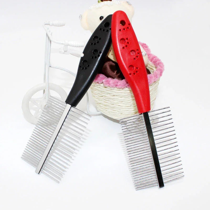 Blue pet grooming comb resting on white surface showcasing plastic handle and stainless steel teeth