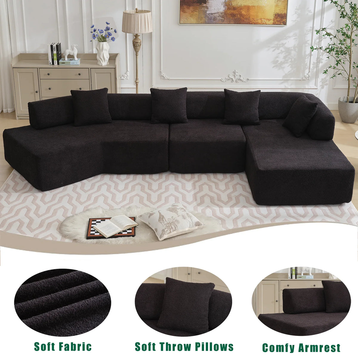 Front perspective of large modern black L-shape couch in a bright living room.