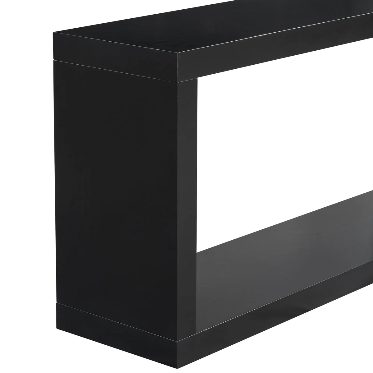 Black square entrance table under a round mirror in a minimalist styled entryway