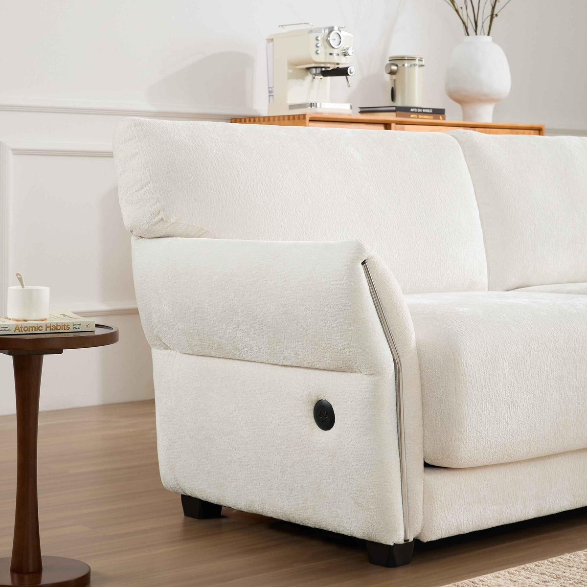 White L-shaped modular sectional sofa with extra-wide seat cushions and built-in USB charging port.
