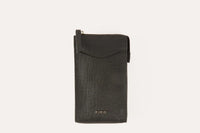 Genuine saffiano leather crossbody phone wallet with zip closure and slim profile in soft pink.