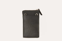 Close-up of two external sleeve pockets on the pink saffiano leather phone wallet.