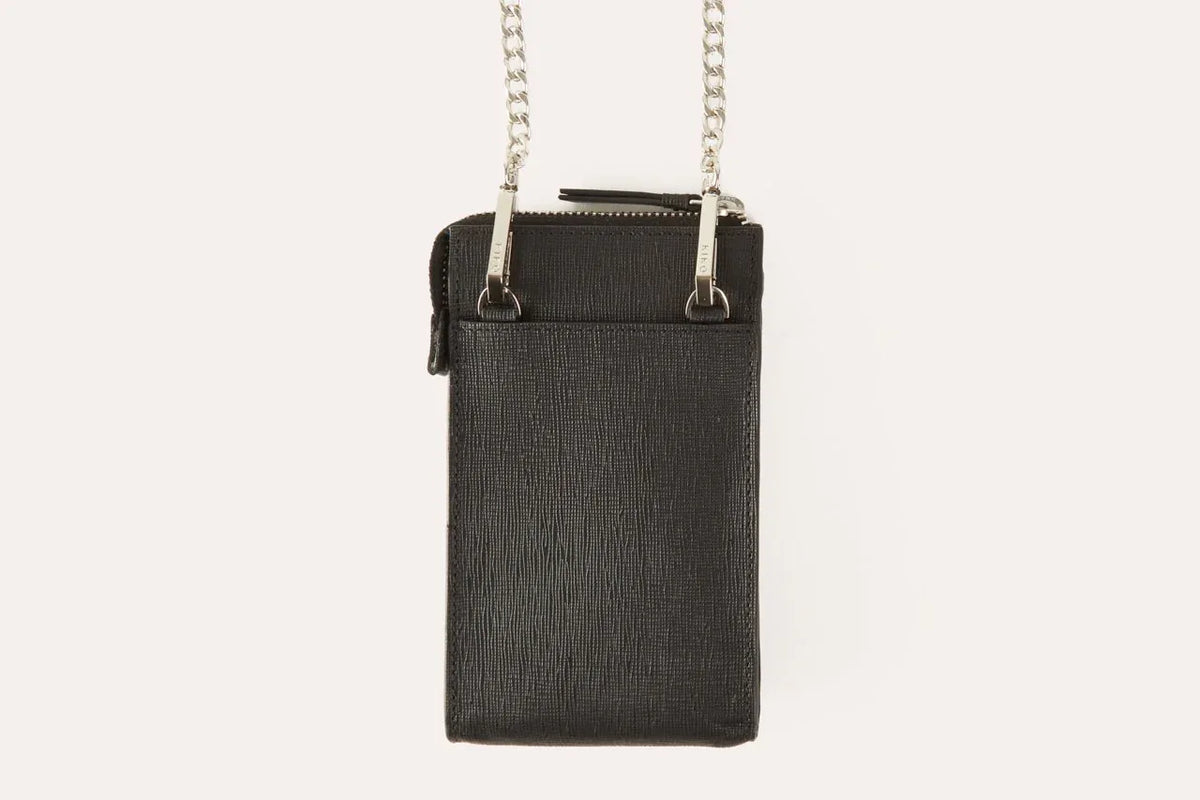 Pink crossbody phone wallet shown from side highlighting slim 1 inch depth.