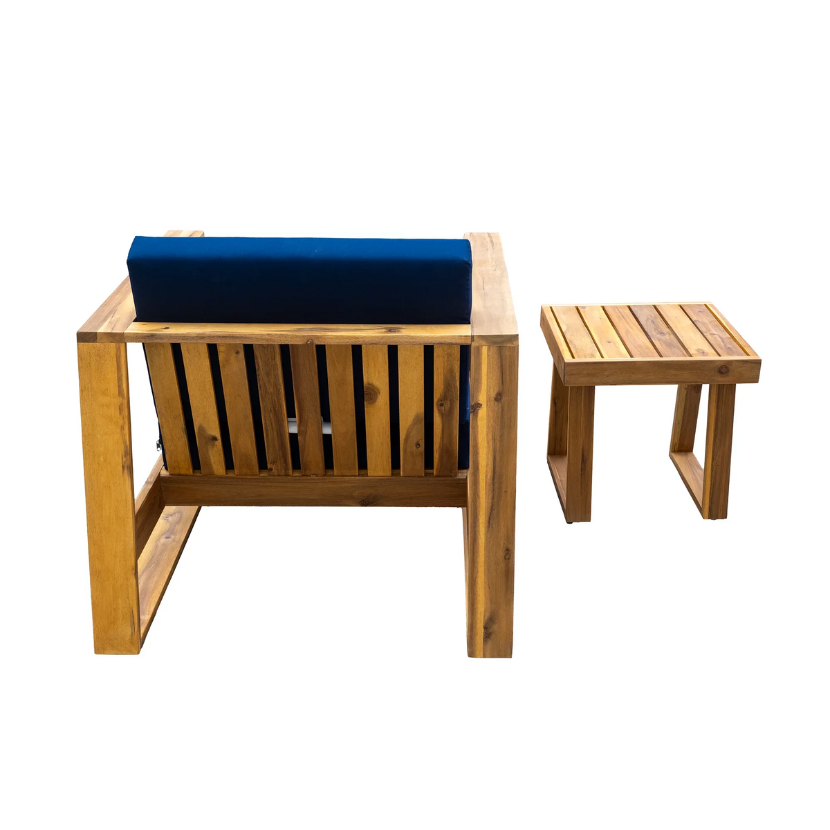 Outdoor patio setup with acacia wood lounge chair and ottoman with blue cushions