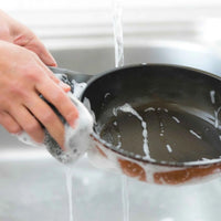 Black Cheftop frying pan with long handle displayed on plain white background