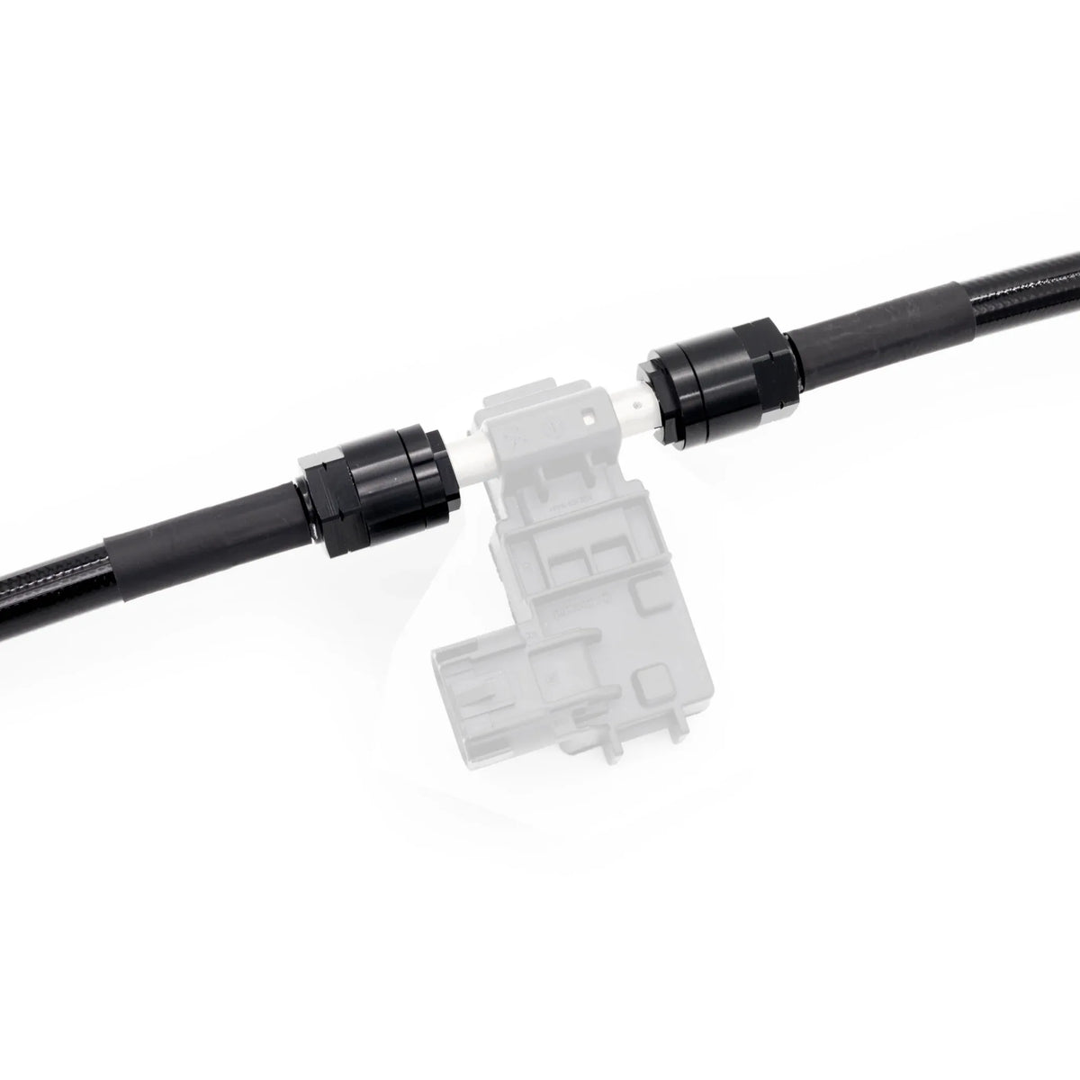 Close-up of PTFE fuel lines and fittings designed for ethanol safe installation in BMW
