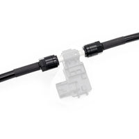 Close-up of PTFE fuel lines and fittings designed for ethanol safe installation in BMW