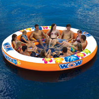 Inflatable Stadium Islander floating island with people enjoying water lounge on a calm lake