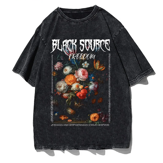 Close-up of vintage washed oversized T-shirt with gothic rose and letter print on charcoal fabric.