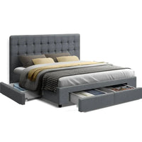 Grey king size bed frame with padded faux linen upholstery and tufted headboard in a modern bedroom.