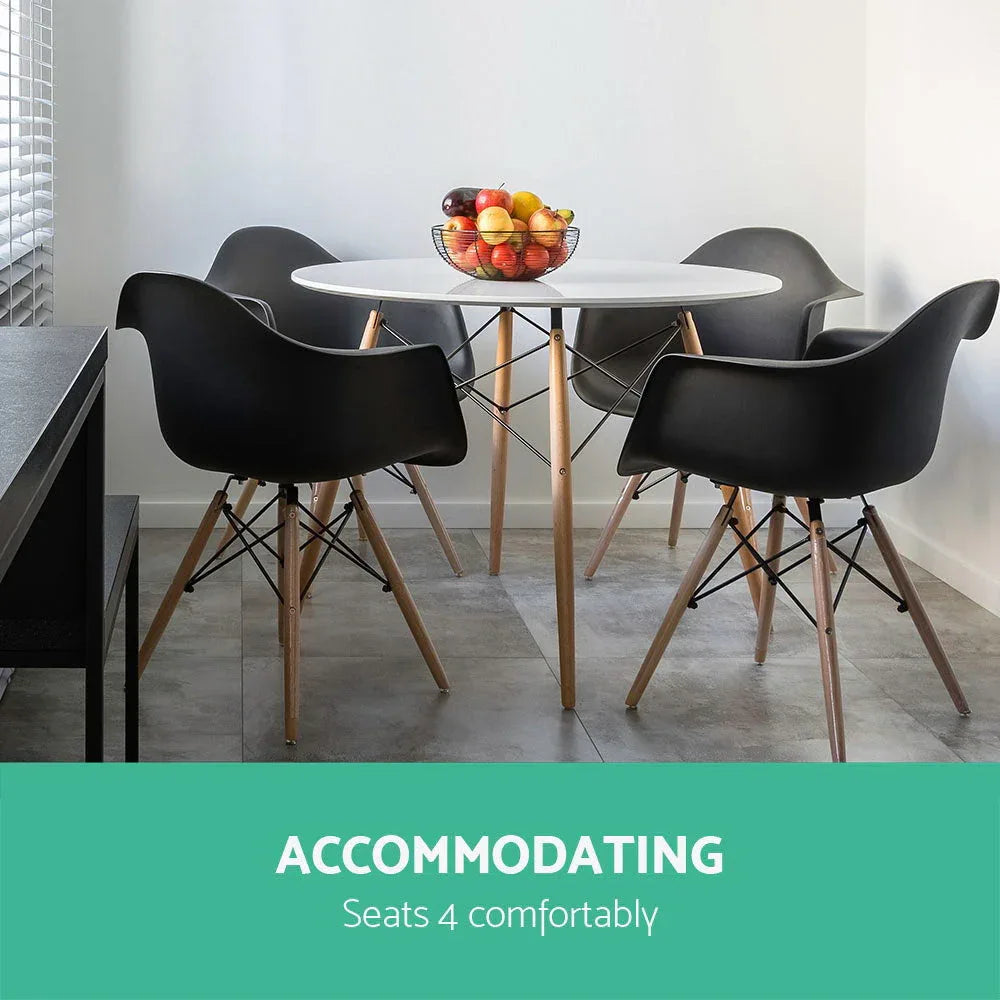 Side view of round wooden-legged dining table with clear design details