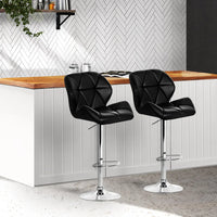 Close up of height adjustment mechanism and chrome base of kitchen bar stool