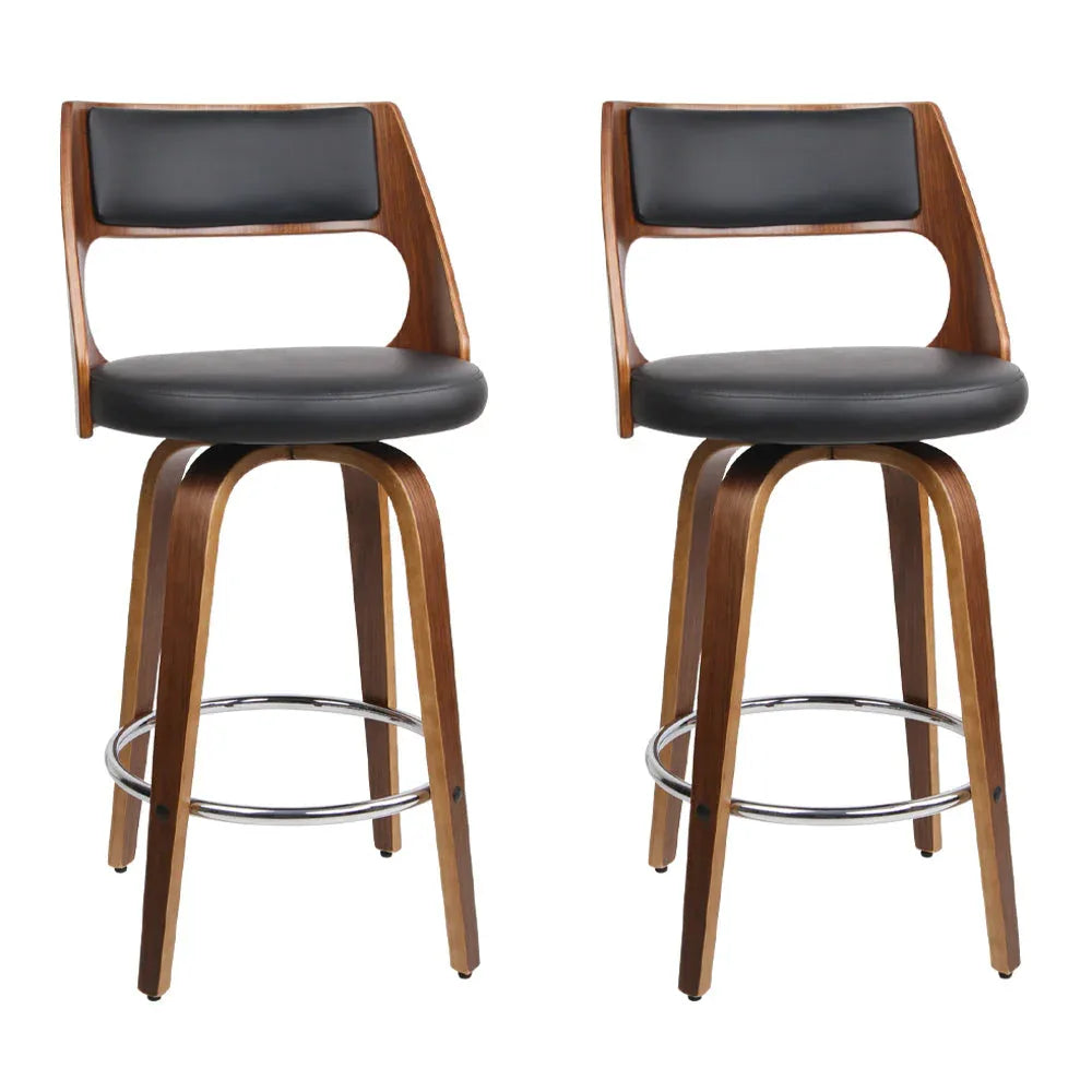 Pair of black wooden bar stools with PU leather seats and walnut-finished legs, shown from front on white background.