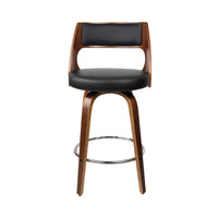Close-up of the black PU leather padded seat and curved backrest on a wooden bar stool.