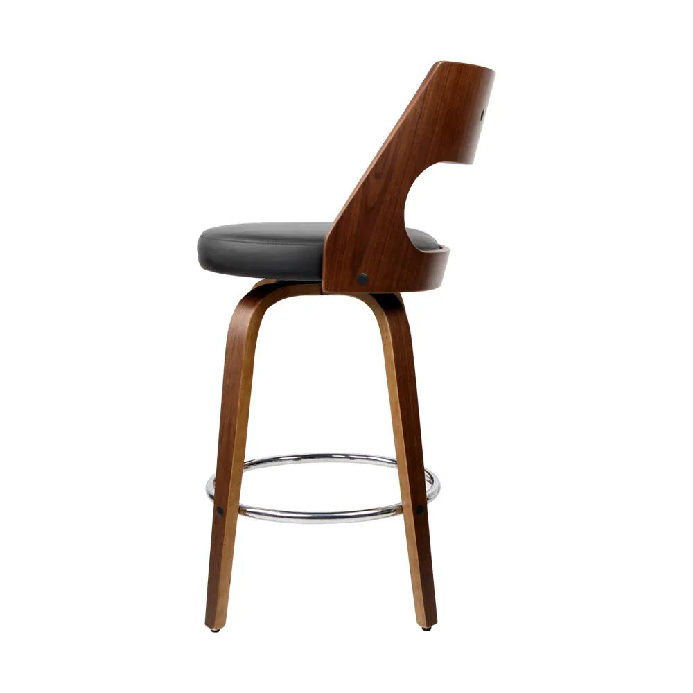 Detail of the swivel seat mechanism on the black wooden bar stool.