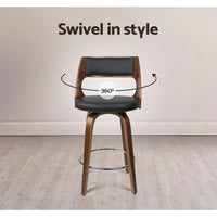 Back view of black bar stools highlighting the wide curved backrest and seat padding.