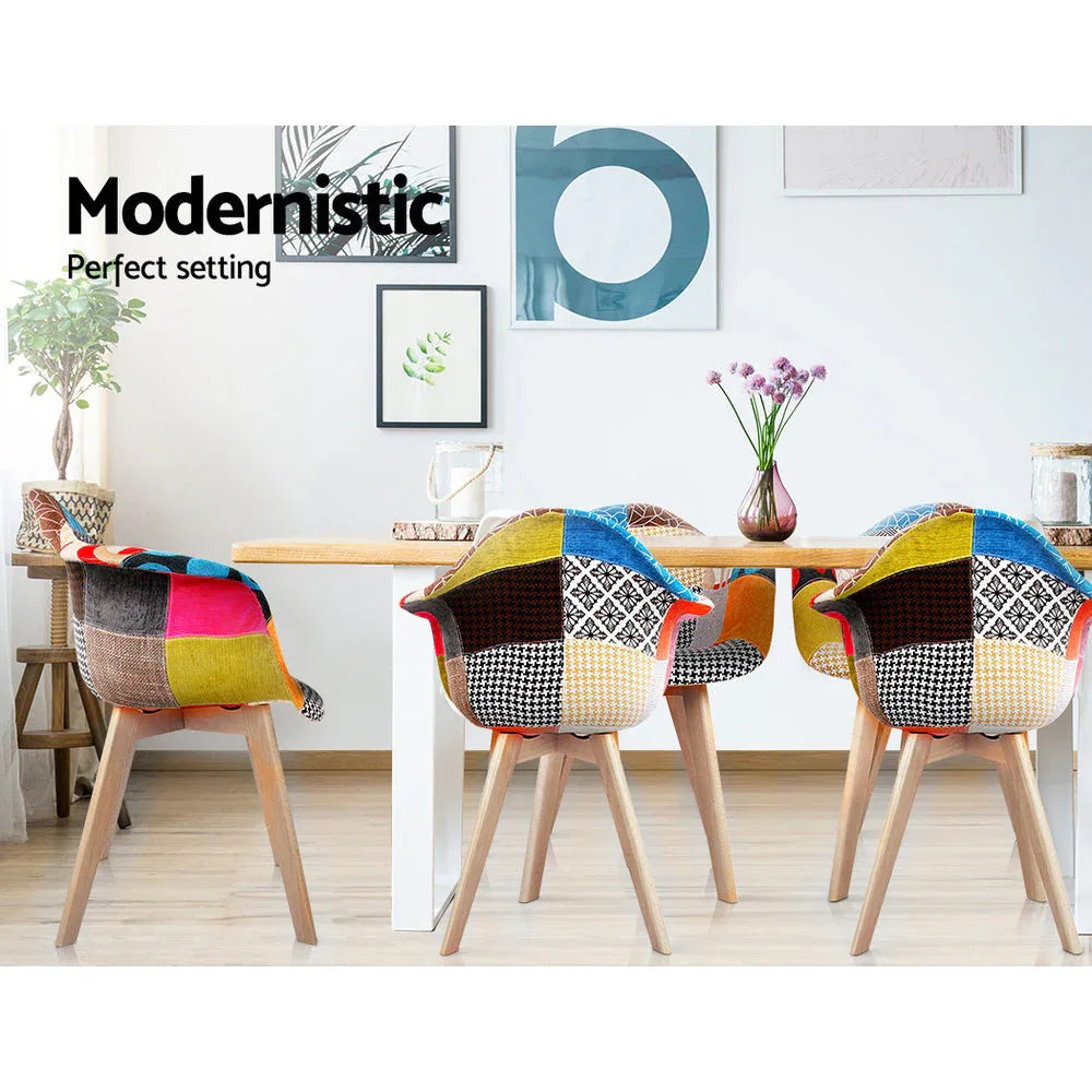 Pair of beige fabric dining chairs positioned side by side on white background.