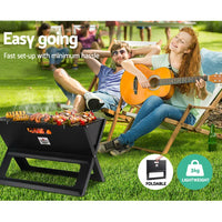 Collapsible portable charcoal BBQ grill disassembled showing parts and structure